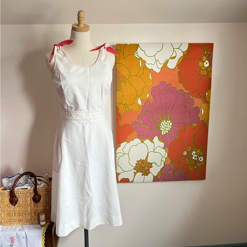 Vintage mini dress with red detail and polka dot ties at shoulder
